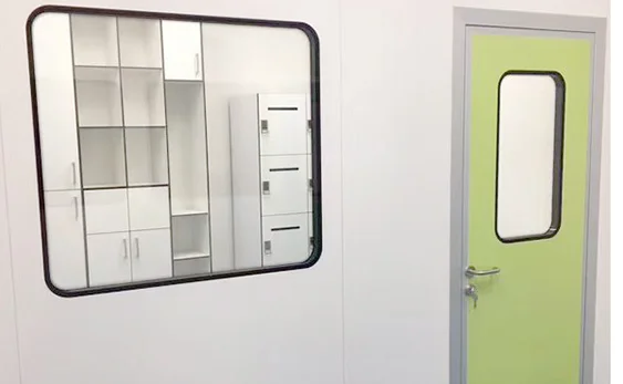 Detailed view of a cleanroom false ceiling system integrated with modular partition walls