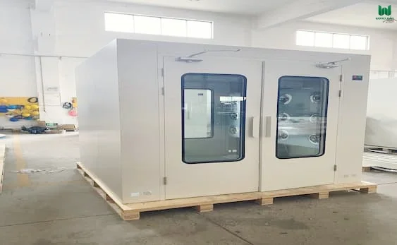 Installation of a modular cleanroom air shower with smart interlock technology integrated into a pharmaceutical sandwich panel wall