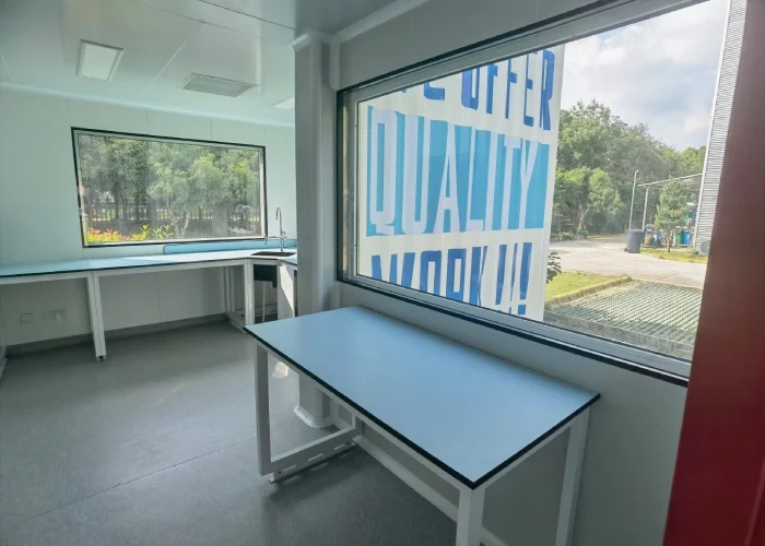 Pharmaceutical modular cleanroom with windowed process room and cleanable wall panels