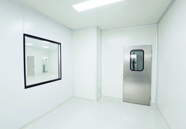 Real cleanroom wall system with flush vision window and cleanroom door interface