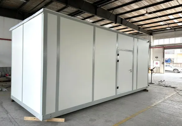 Container laboratory cleanroom interior with white wall panels cleanroom door return air grille and utility outlets