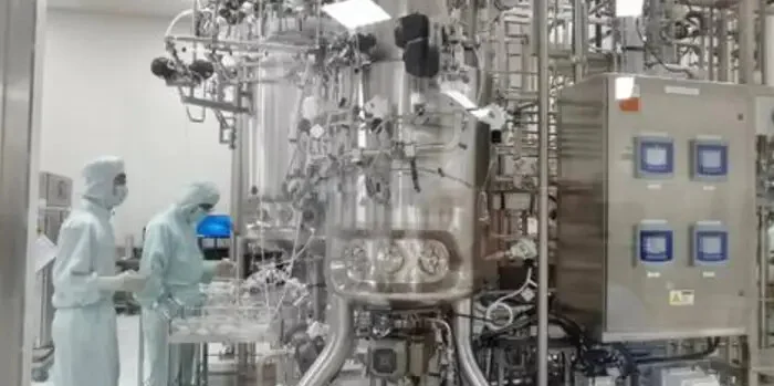 Illustrative biopharmaceutical processing room with stainless-steel reactor and utility skid