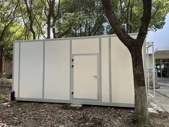 Ark-style modular laboratory with white cleanroom panels installed among mature trees on a Chinese Academy of Sciences research campus in Shanghai